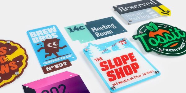 Colorful custom acrylic signs with various designs and text